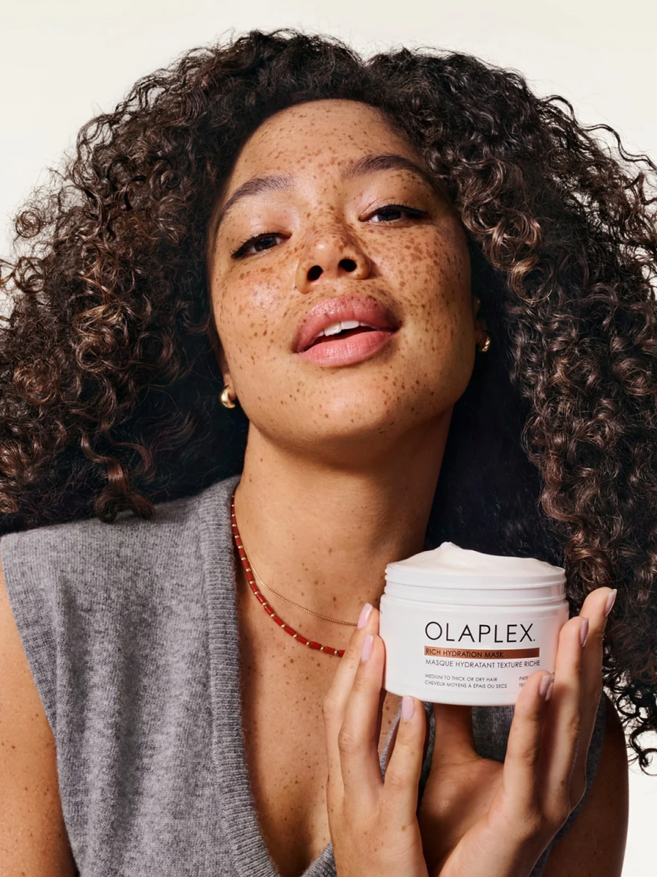 Woman holding Olaplex product