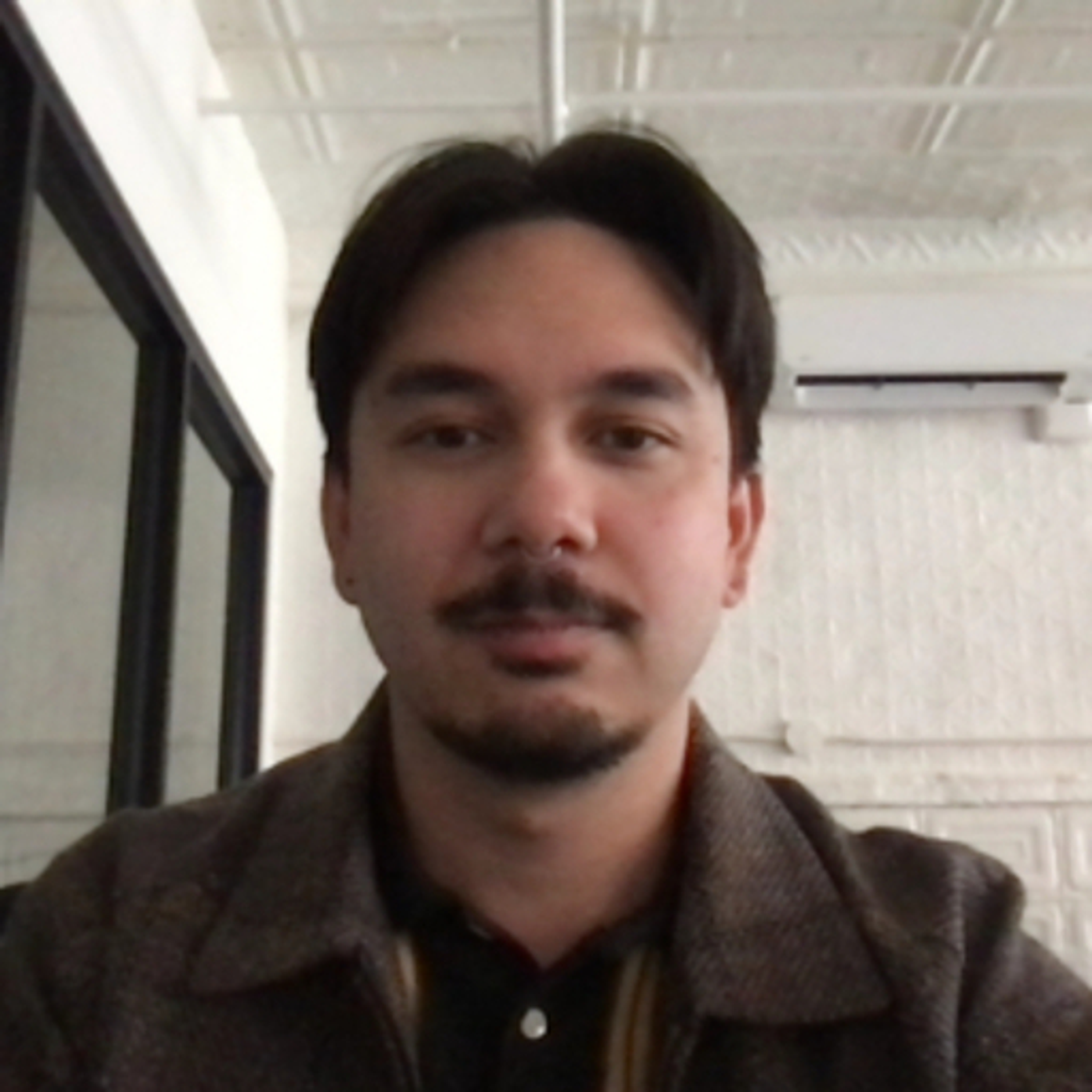 Headshot of Johnnie Regalado