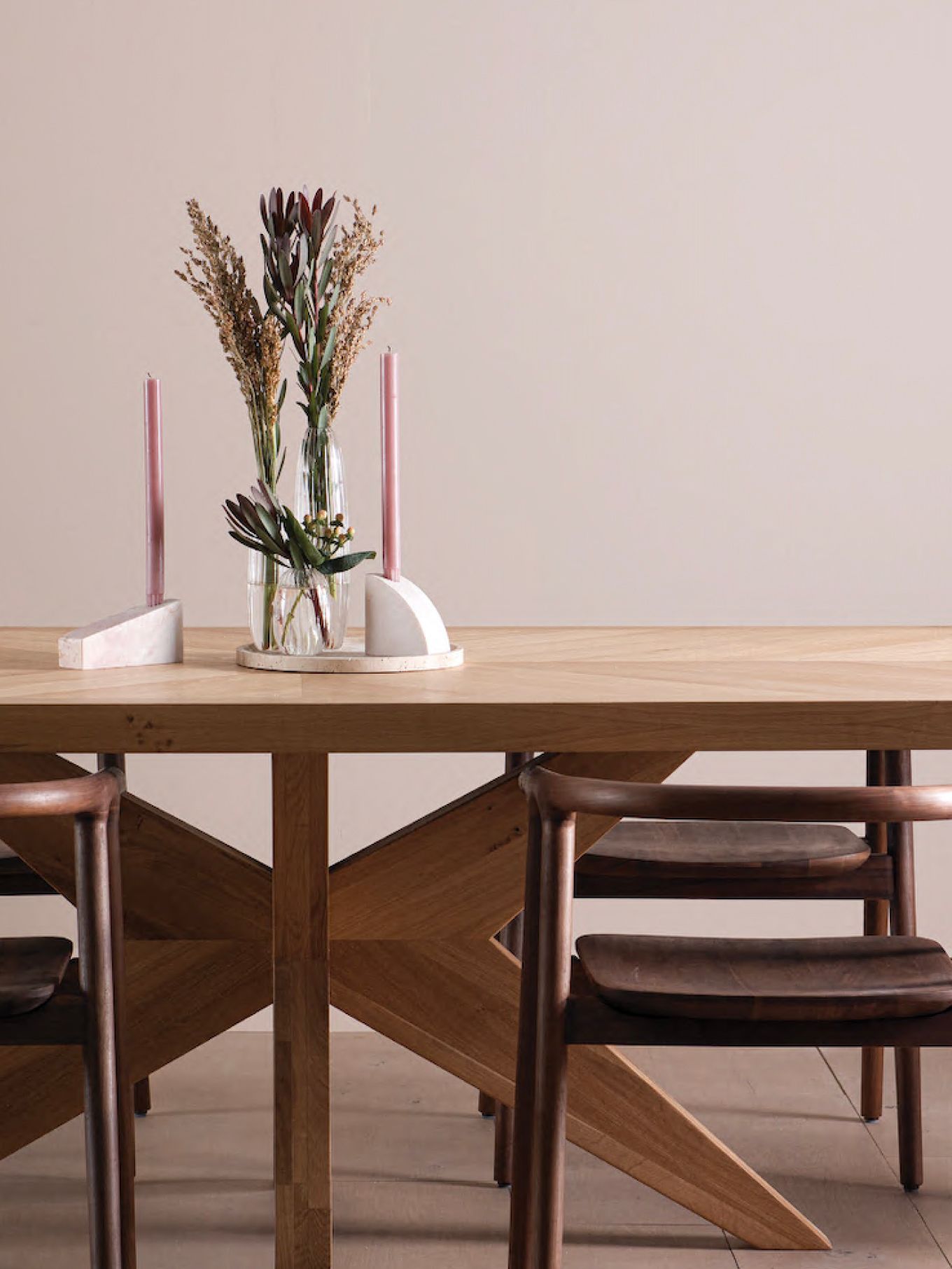 Dining table with candles and flowers by Industry West