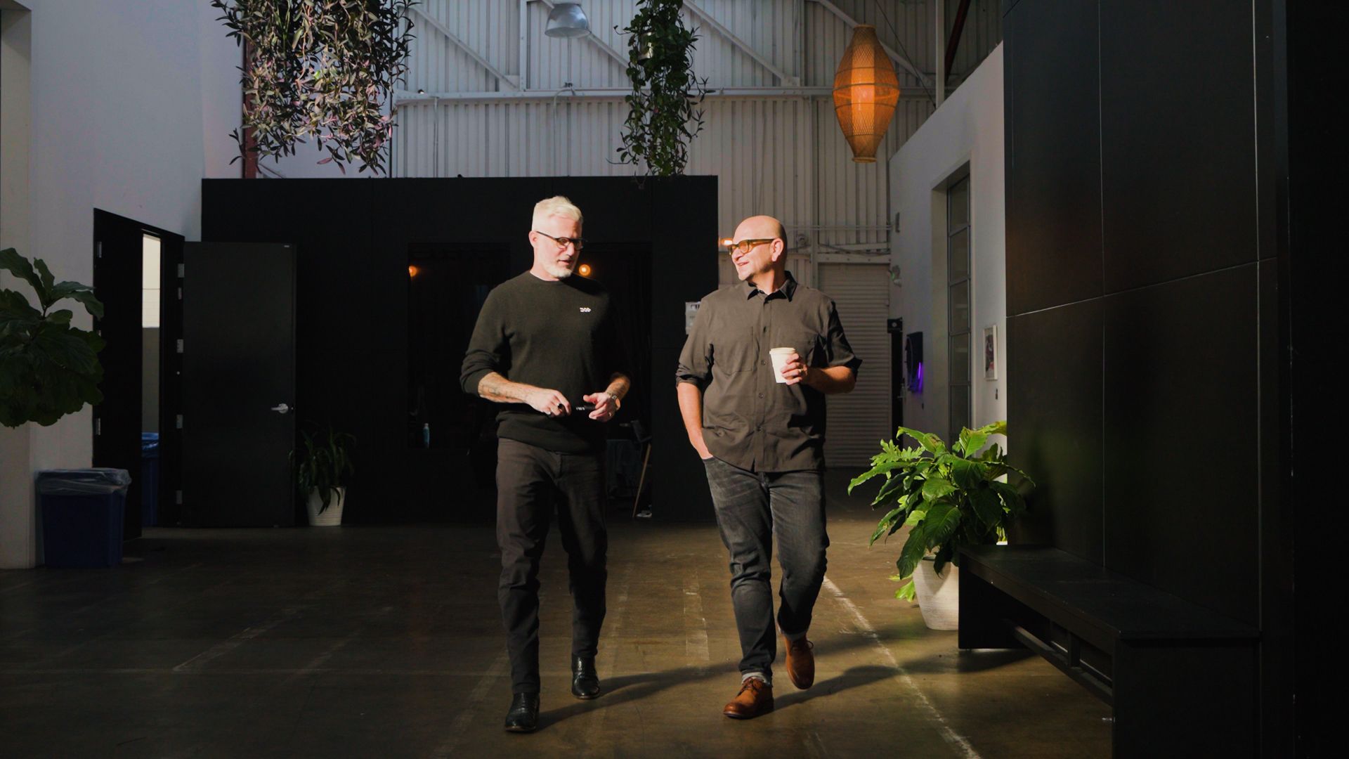 Marko & Isaac walking through an office