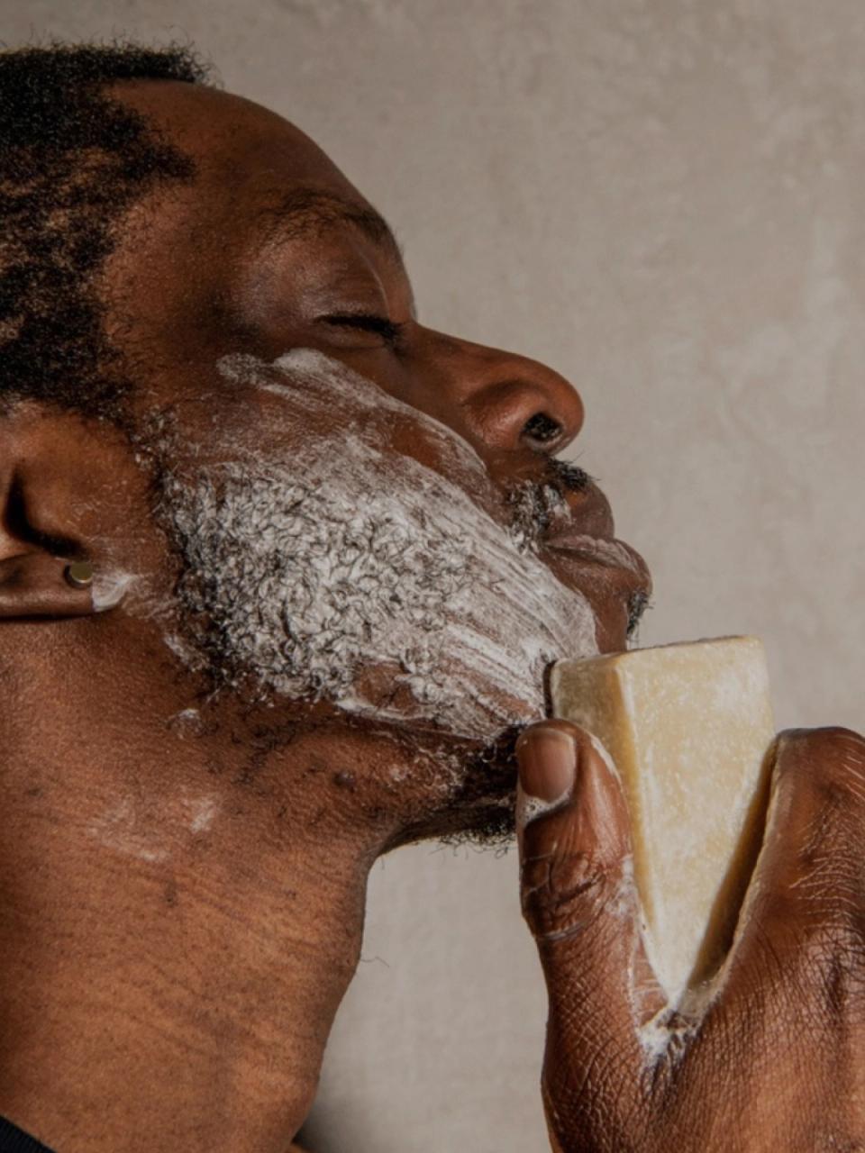 man applying Package Free Soap to his beard