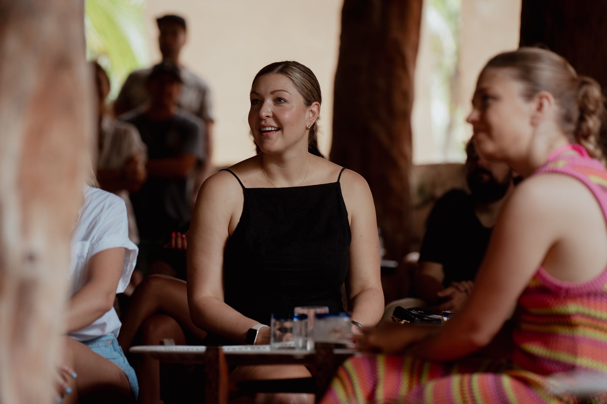 Chelsey and Kim listening to a presentation