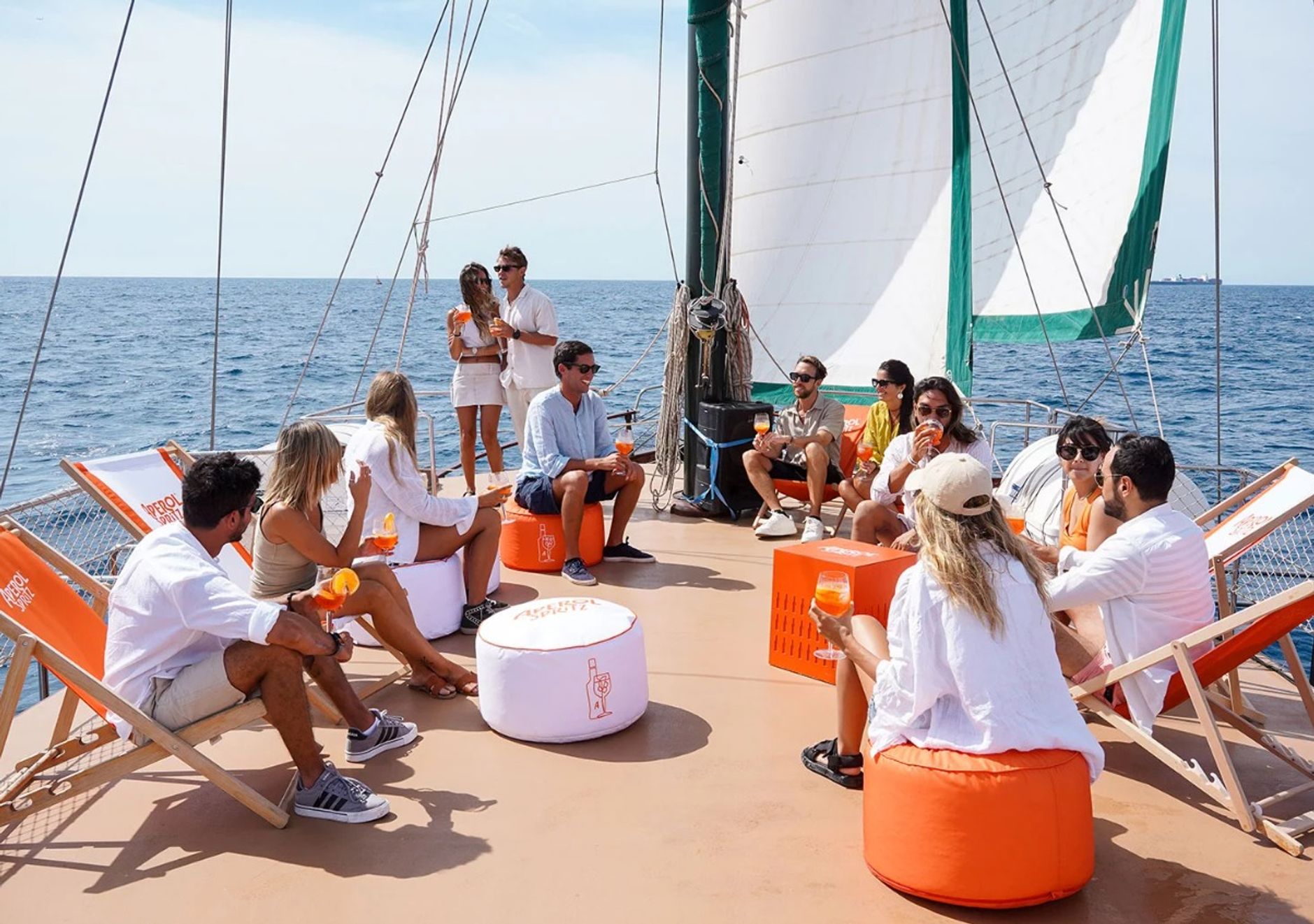 people having a drink on a boat at sea