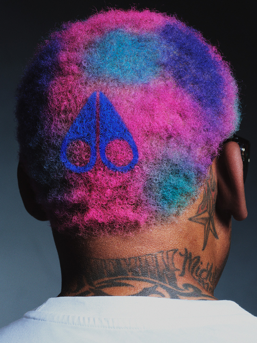 Colorful hair and logo of Moose Knuckles