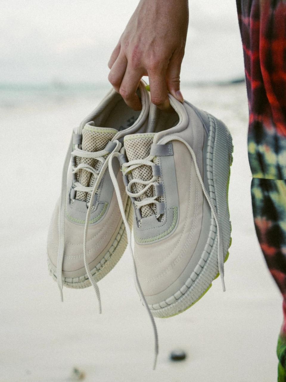 Cougar sandals floating against a grey backdrop