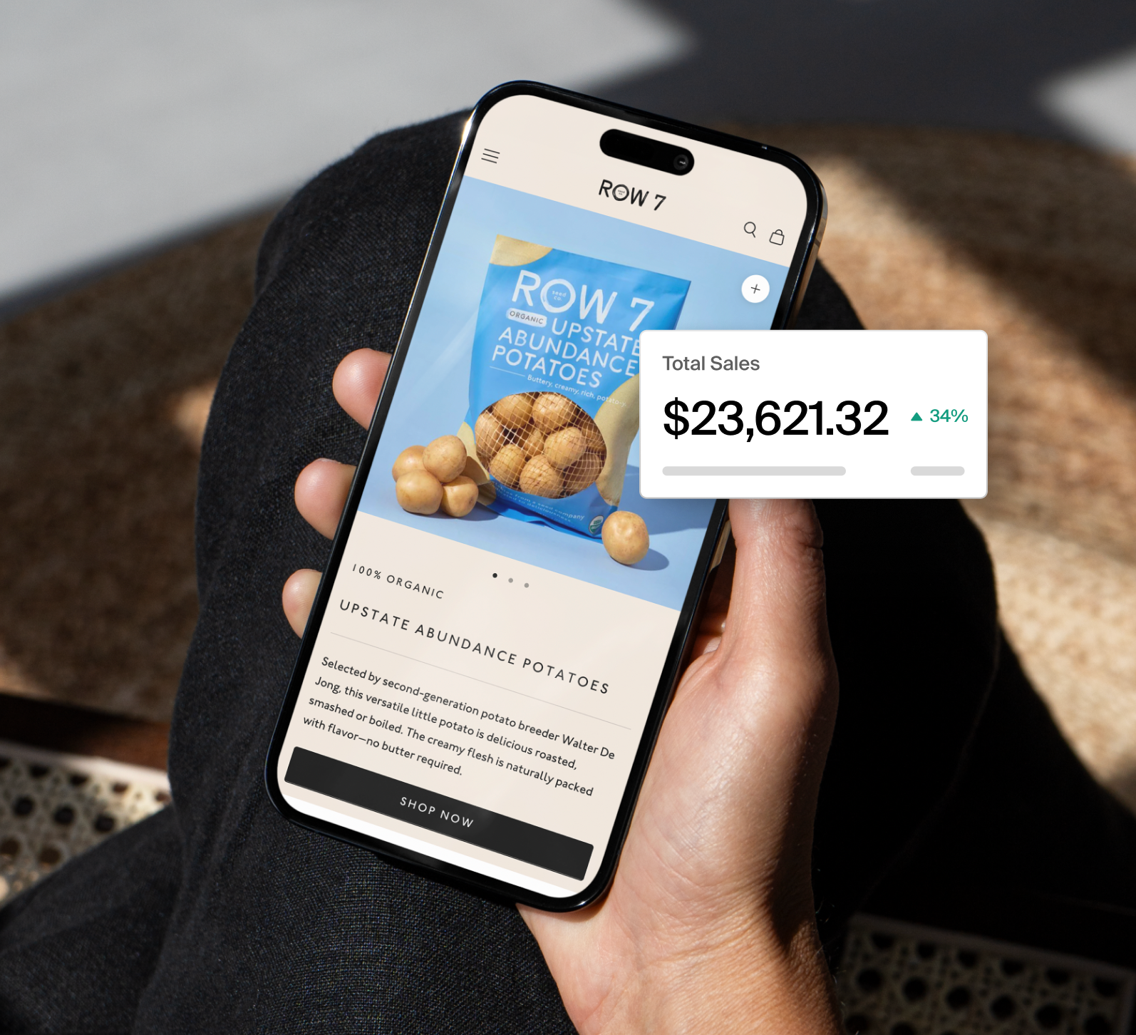 Row 7 Seeds website on a mobile phone, with a widget displaying total sales