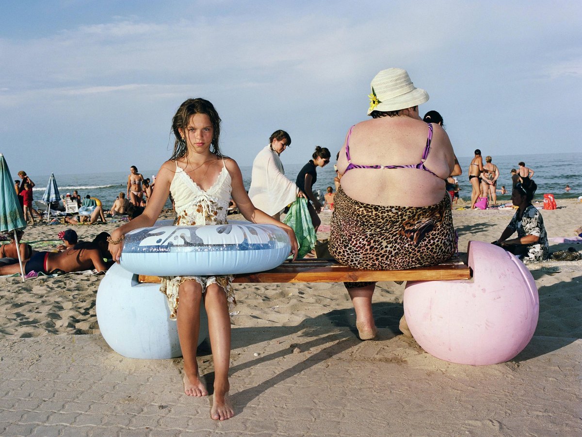 Granddaughter and grandmother on Arkadia Beach, Odesa, 2017 by Mark Neville © Mark Neville