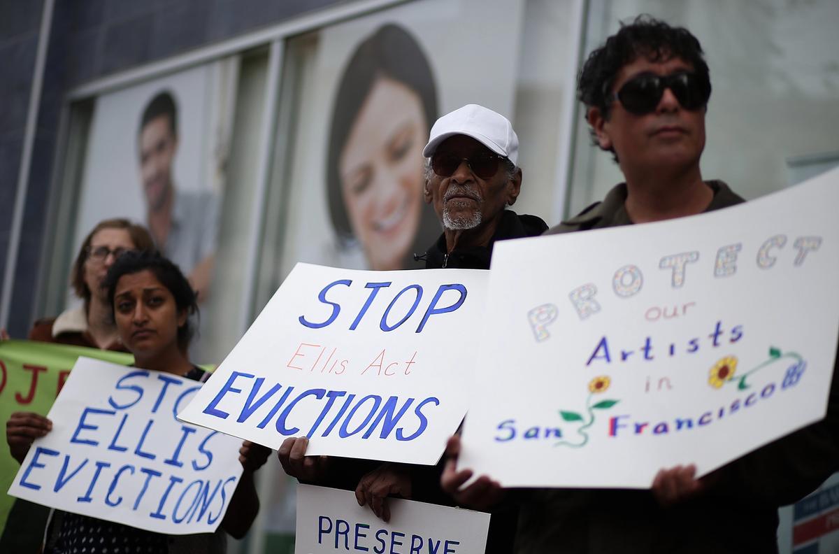Tenants of 1049 Market Street in San Francisco, including artists, protest against the landlord's attempts to evict them from the rent-controlled building in 2016 Photo by Justin Sullivan/Getty Images