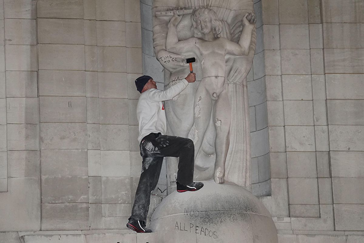 A man was arrested after climbing onto Eric Gill's statue of Prospero and Ariel outside the BBC's headquarters in central London and hitting it with hammer © PA Images / Alamy Stock Photo