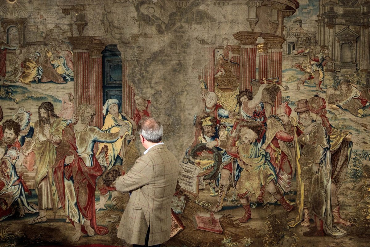 The former director of the Metropolitan Museum of Art Thomas Campbell inspects a 16th Century tapestry depicting St Paul burning heathen books
Photo: Jack Taylor/Getty Images