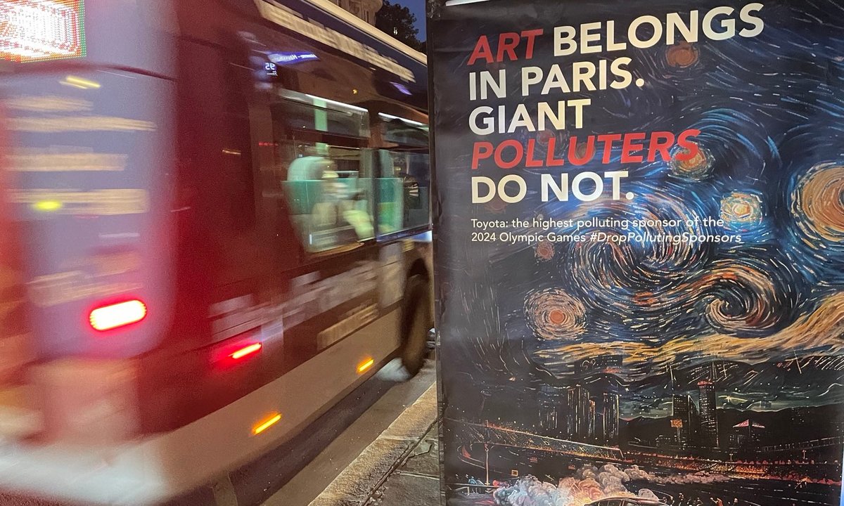 J’accuse! Guerrilla artists take a swipe at ‘polluting’ Olympics sponsor J’accuse! Guerrilla artists take a swipe at ‘polluting’ Olympics sponsor