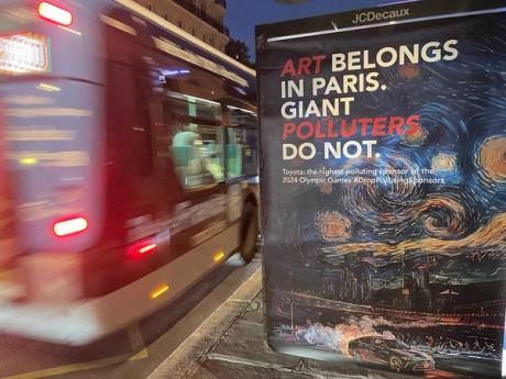  J'accuse! Guerrilla artists take a swipe at 'polluting' Olympics sponsor 