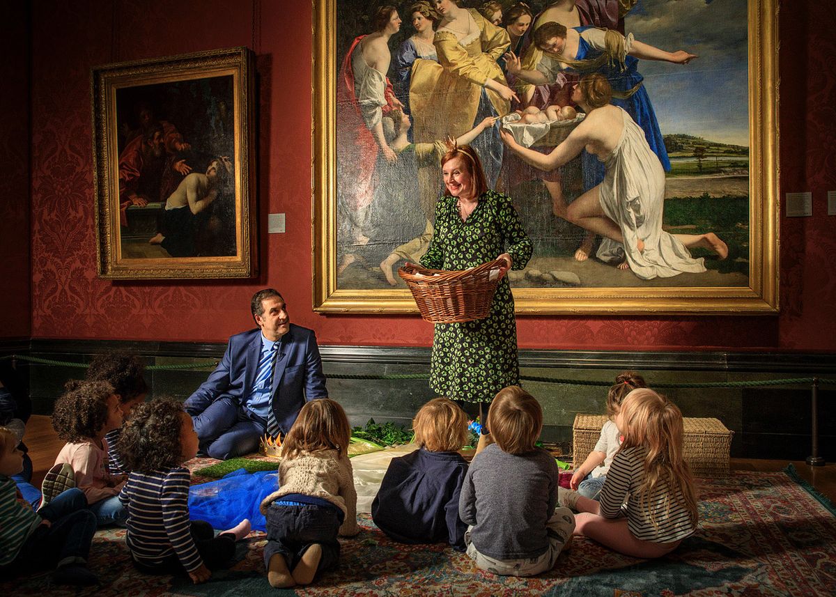 Gabriele Finaldi, the National Gallery director, and Fiona Alderton, one of the gallery's eductors, with a group of children in front of Orazio Gentileschi’s The Finding of Moses, which has been on long-term loan to the National Gallery since 2002 © The National Gallery, London