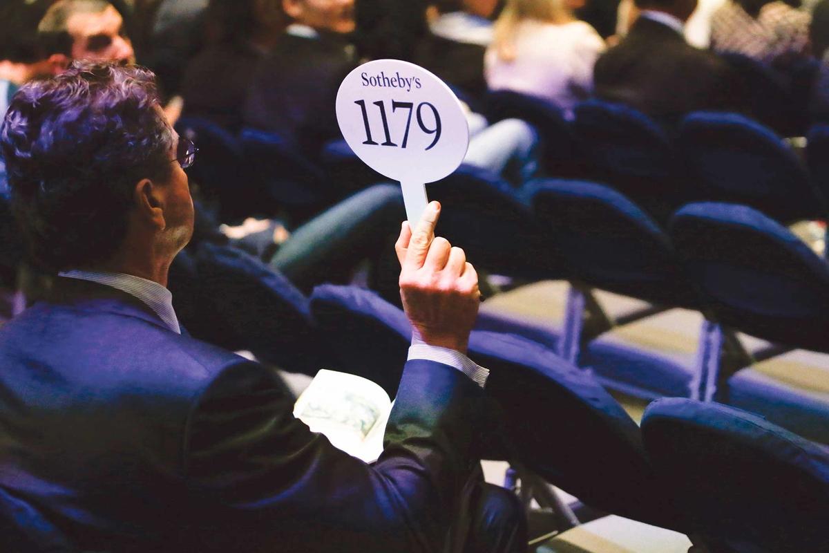 A bidder at Sotheby’s in New York; the surprise winding back of auction regulations by the New York City Council is akin to taking “down all the traffic lights and doing away with speed limits overnight”, one legal expert says Kena Betancur/Getty Images



