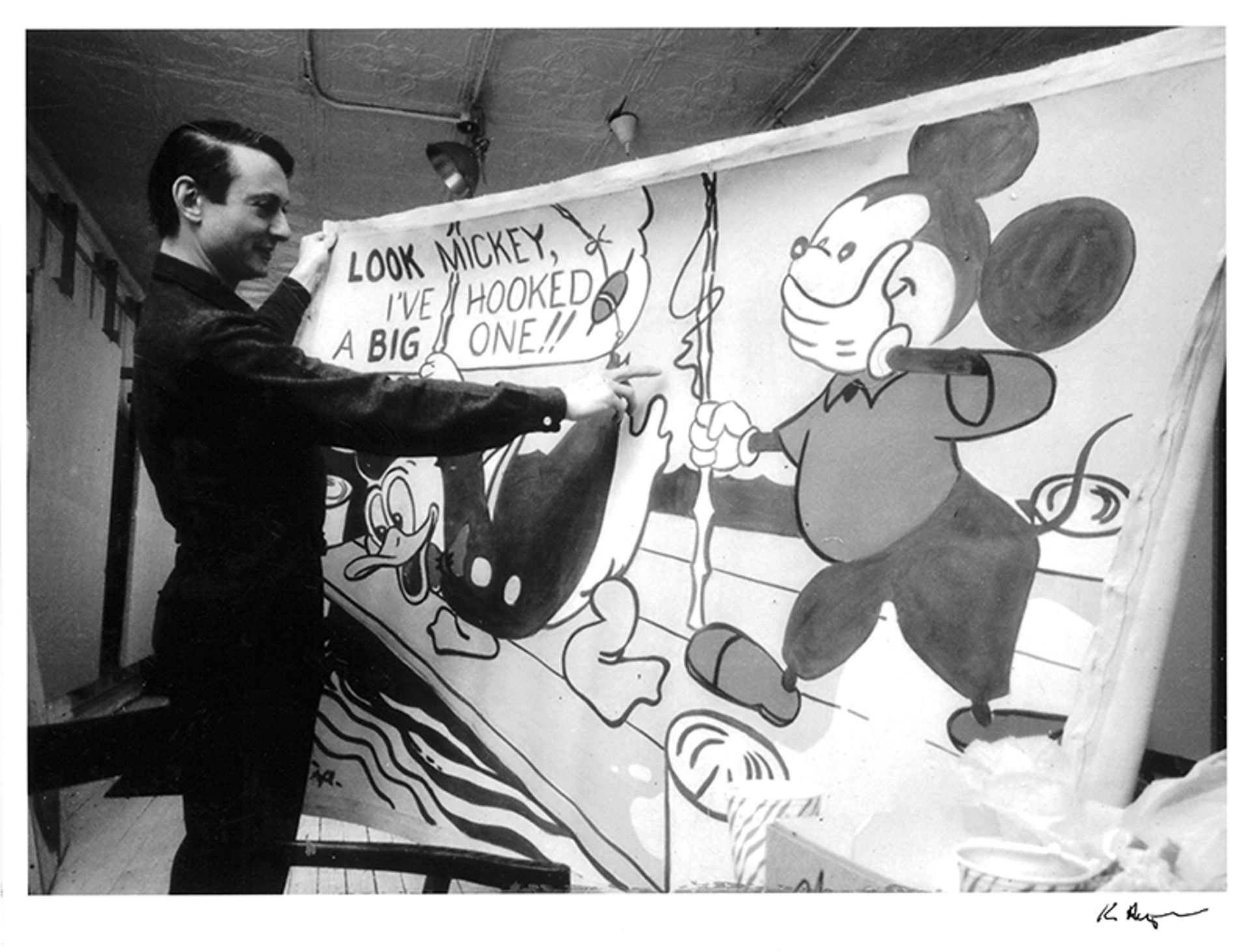Roy Lichtenstein with his painting Look Mickey (1961) in his West 26th Street studio, 1964 National Gallery of Art; Photograph: © Ken Heyman, Courtesy The Roy Lichtenstein Foundation
