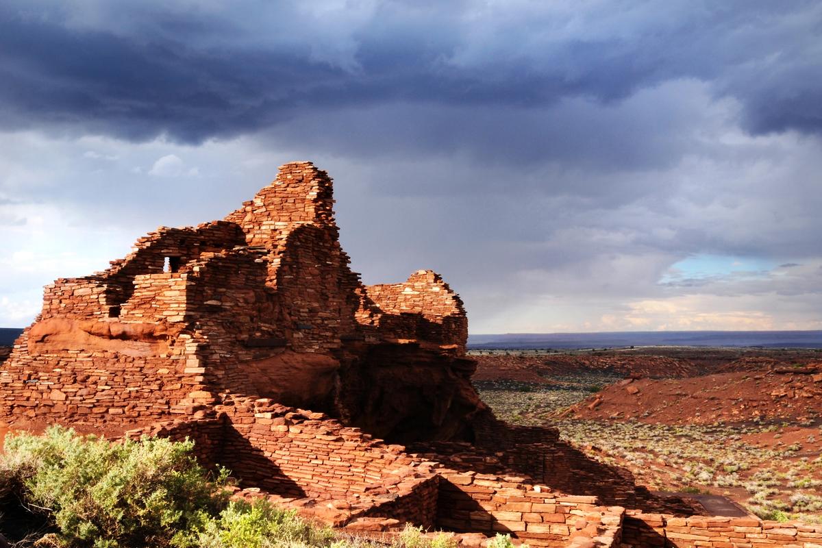 The Wupatki Pueblo rises four stories above the landscape and is made up of over one hundred rooms