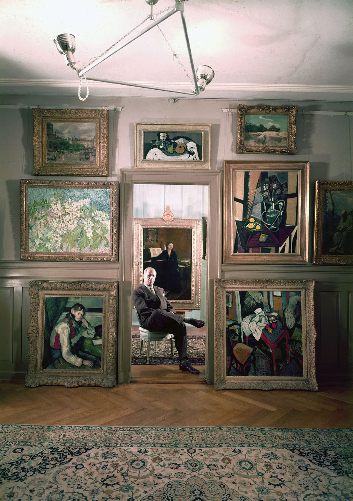 The German-born Swiss industrialist and art collector Emil Georg Bührle posing with his paintings in Zurich in 1954 Dmitri Kessel/The LIFE Picture Collection via Getty Images