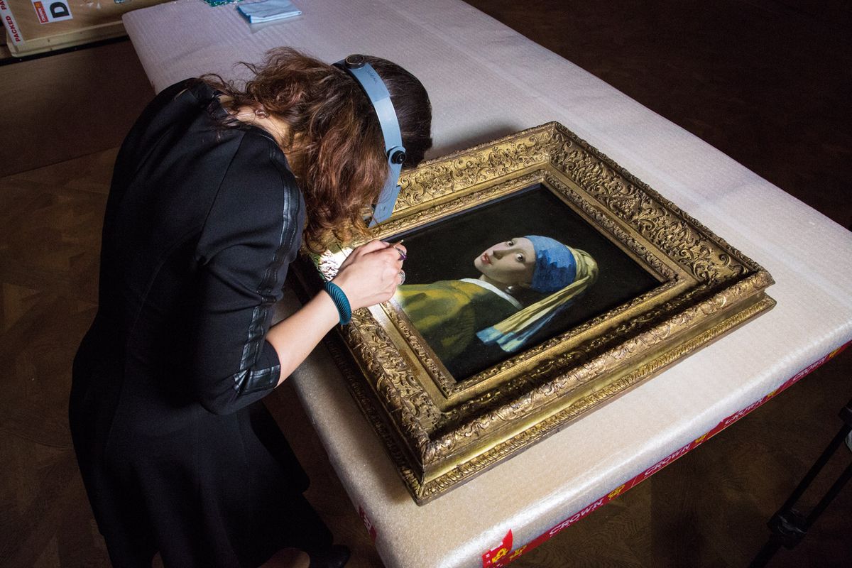 Vermeer’s Girl with a Pearl Earring (around 1665) being analysed in the Hague Ivo Hoekstra; courtesy of the Mauritshuis, The Hague