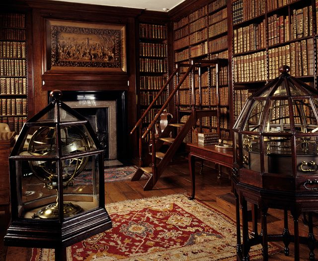 What was the real purpose of the English country house library?