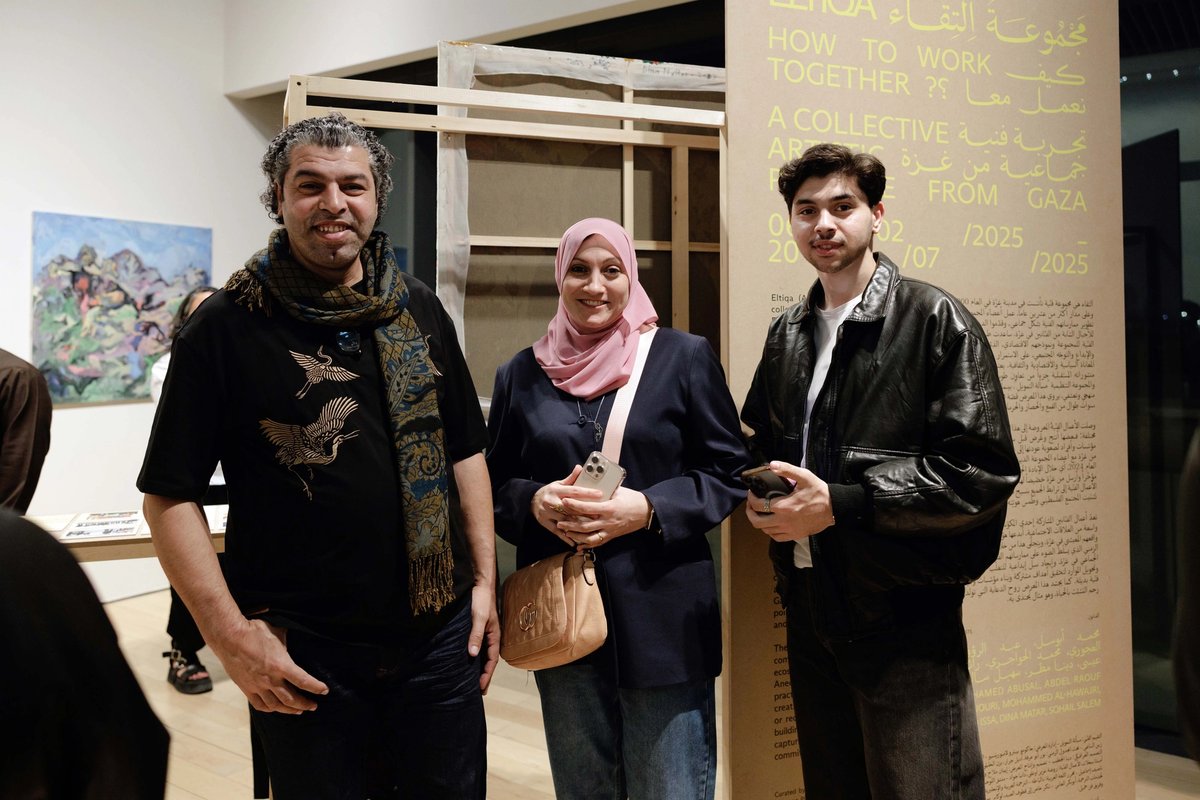 From left: Eltiqa co-founders Mohammad Al-Hawajri and Dina Mattar with their son Ahmad at the opening of Eltiqa: How to Work Together? at Jameel Arts Centre, Dubai. The family fled Gaza with nothing but the couple’s art—more than 500 works Courtesy Art Jameel