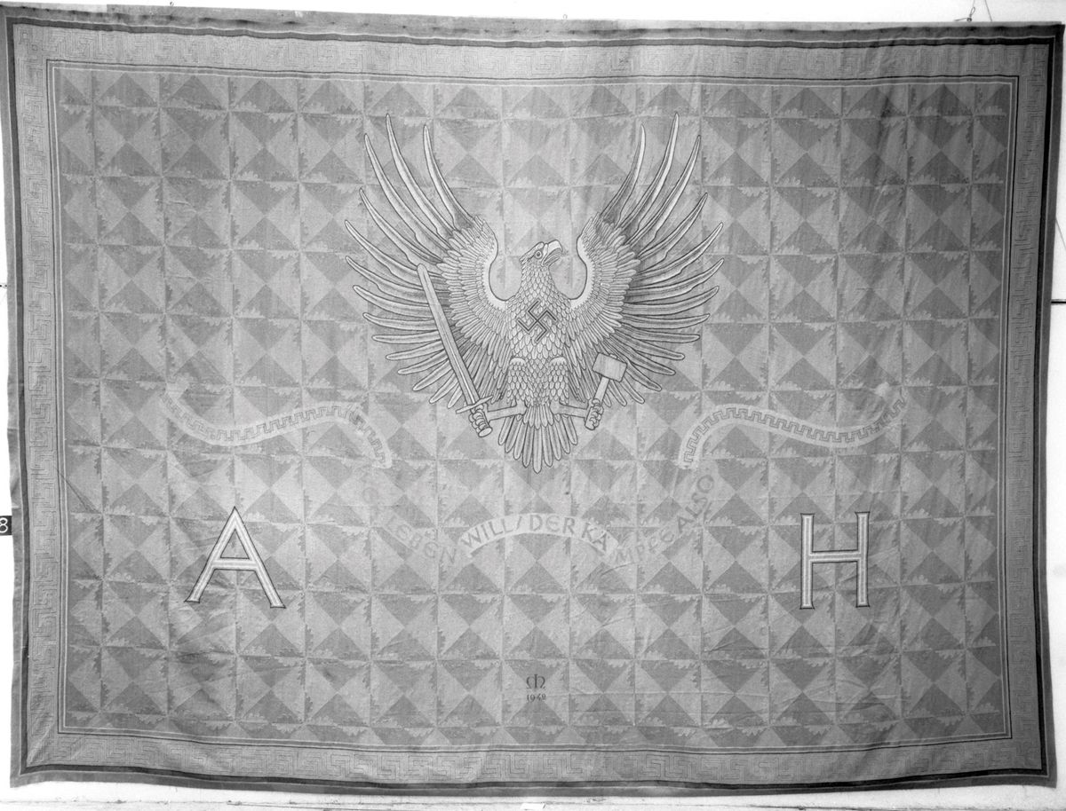 The 5m-high tapestry contains a Nazi slogan from Hitler’s Mein Kampf © National Grand Palais Museums and Louvre Museum, Objets d’art Department