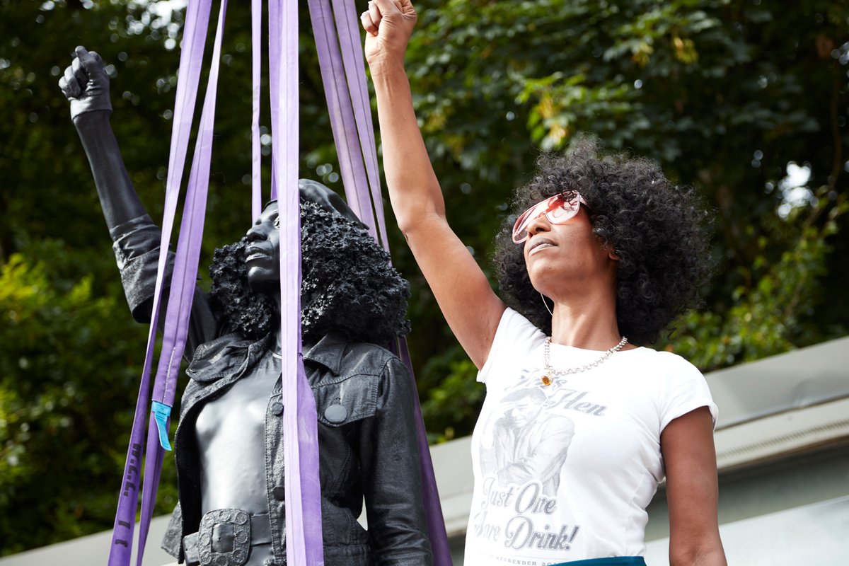 Jen Reid stands with Marc Quinn's A Surge of Power (Jen Reid) 2020, before it is installed Image: © Marc Quinn studio