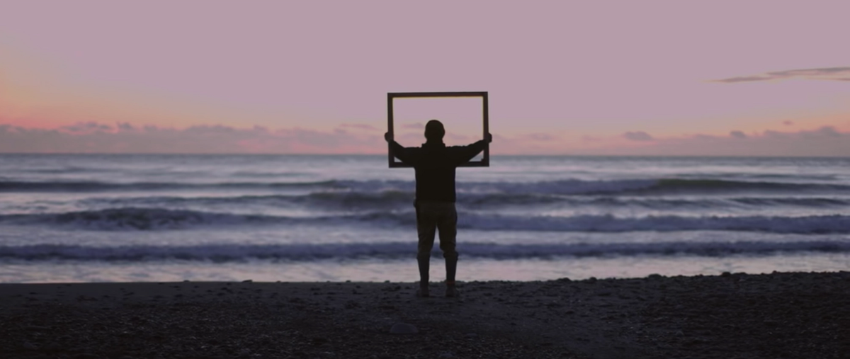 A still from Joe Biden and Kamala Harris's video showing diverse Americans holding up a golden frame, which was inspired by Lorraine O’Grady's 1983 performance Art Is…
