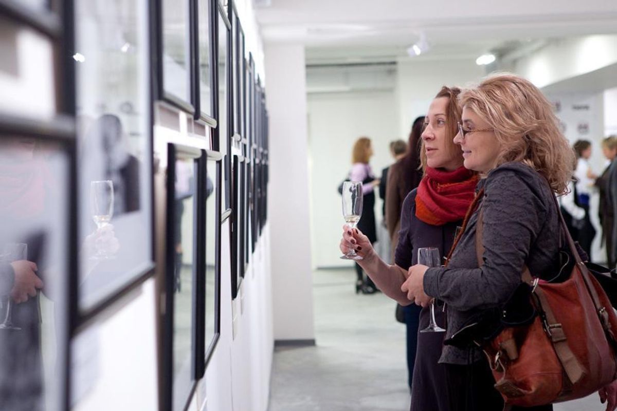 Visitors at an earlier exhibition at Lumiere Brothers Center for Photography Wikimedia Commons