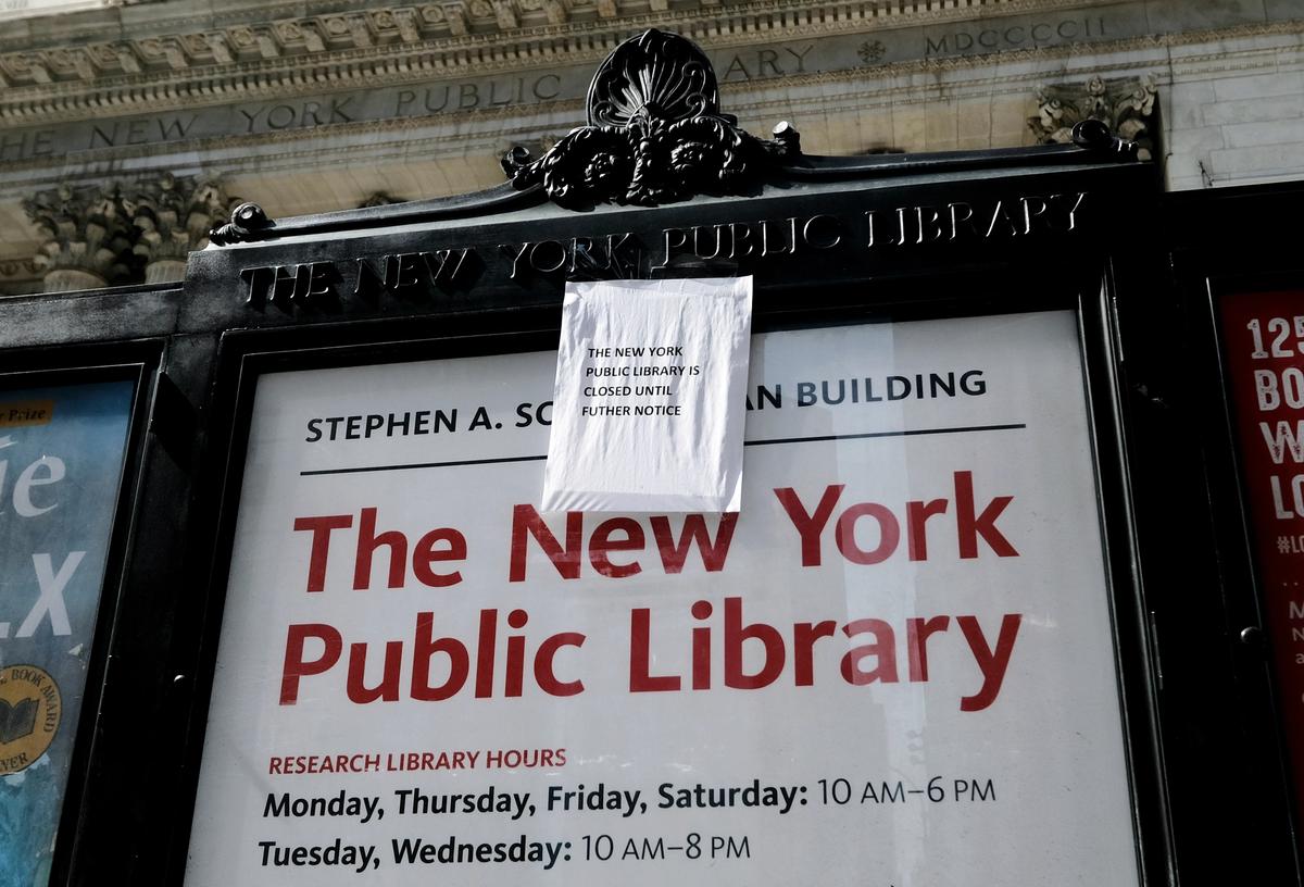 A sign posted outside The New York Public Library announces that the library is closed until further notice Photo by Evan Agostini/Invision/AP