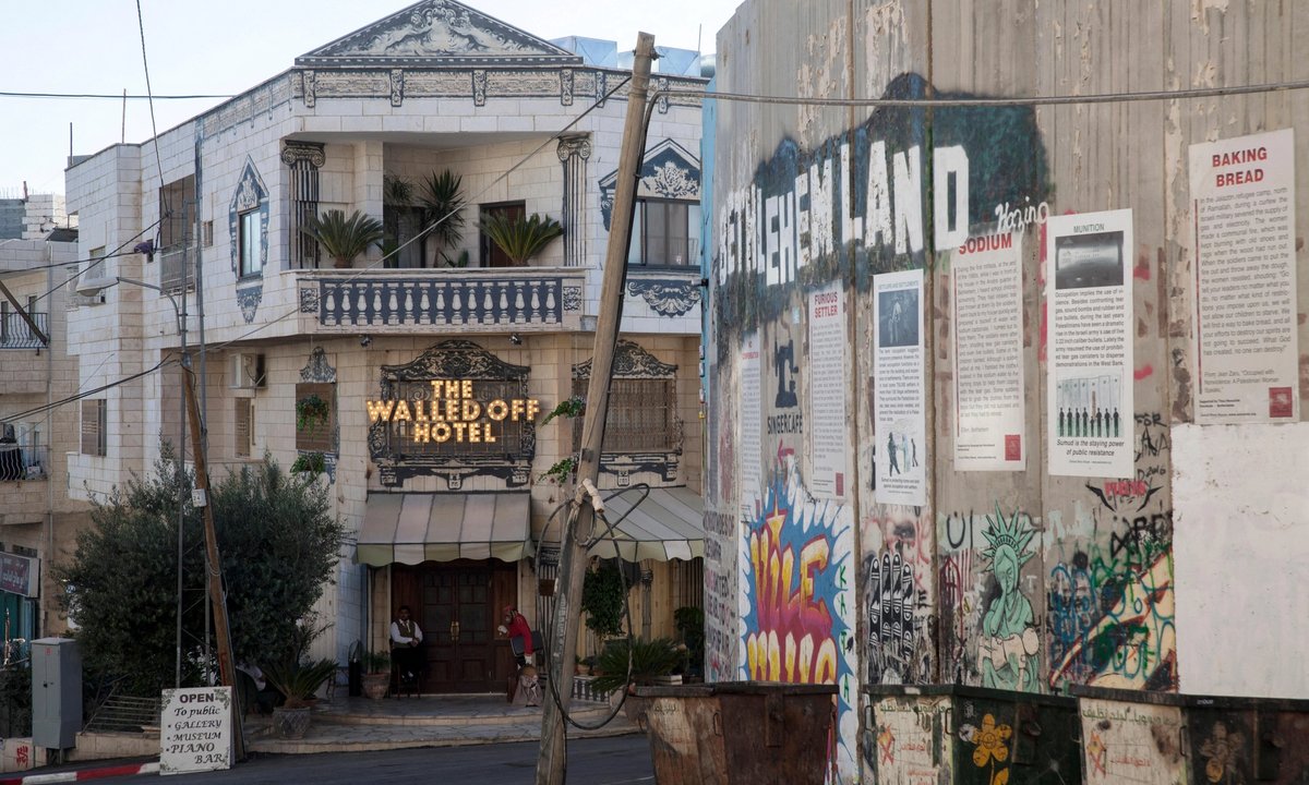 Banksy’s Bethlehem hotel, closed following 7 October attacks, reopens as ‘cultural platform that carries the narrative of Palestine’