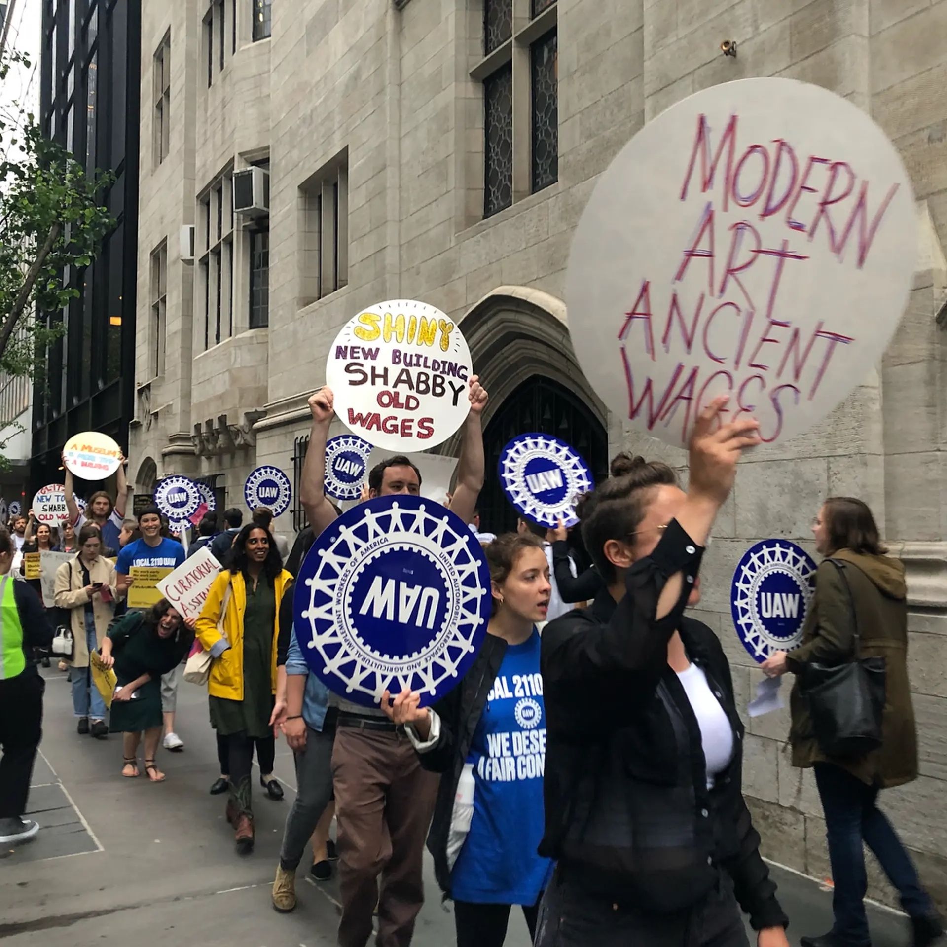 Unionised workers of the Museum of Modern Art and their supporters rally outside the New York museum in 2018 @momalocal2110 via Instagram