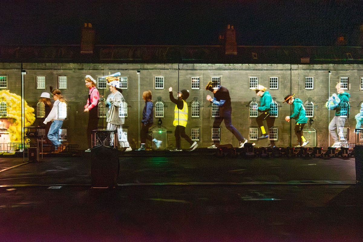 The Maltings Youth Theatre company is projected on to the walls of the barracks parade ground, Berwick-upon-Tweed, as part of Matthew Rosier's film installation Parade (2025) Jennifer Charlton Photography / Courtesy of The Maltings Berwick Trust