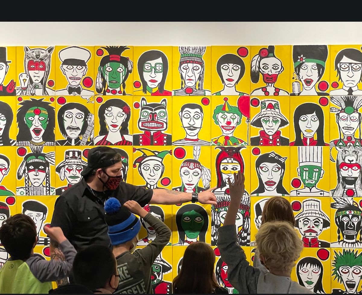 Artist Johnny Bandura discusses his portrait series with students Courtesy the artist