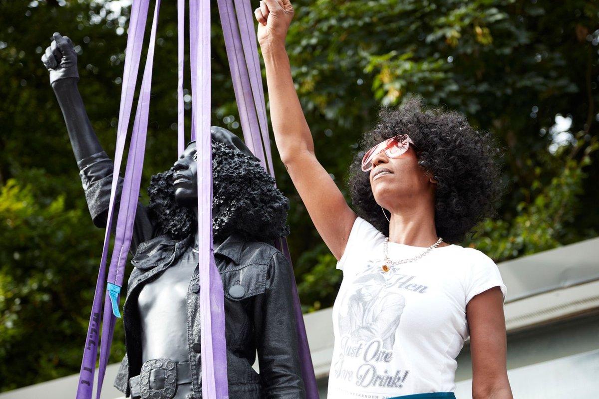 Jen Reid standing with Marc Quinn's A Surge of Power (Jen Reid) 2020, before it was installed Image: © Marc Quinn studio