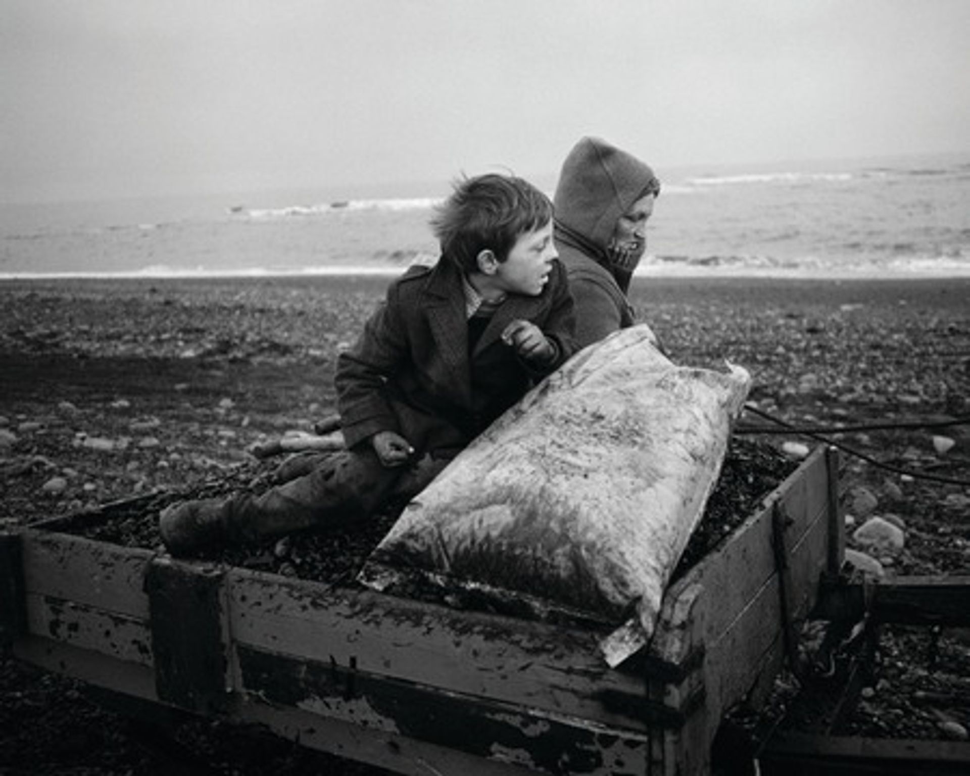 Chris Killip, “Rocker” and Rosie Going Home, Seacoal Beach, Lynemouth, Northumberland;(1983), Gelatin silver print, Gift of the Robert Mapplethorpe Foundation, Inc. (Photo: © Chris Killip)