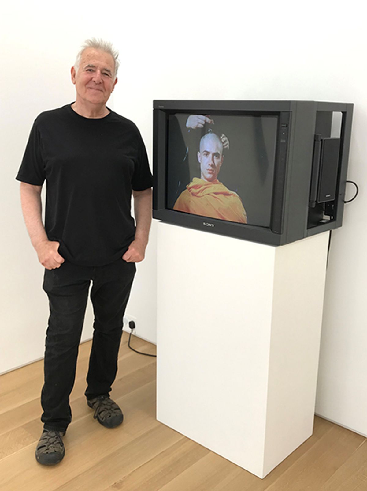 John Smith with his work Om (1986) Courtesy of Marlborough gallery