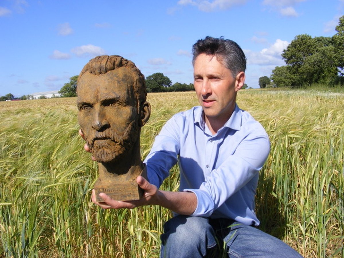 Anthony Padgett with his Van Gogh sculpture, photographed in a Lancashire wheatfield, 2018