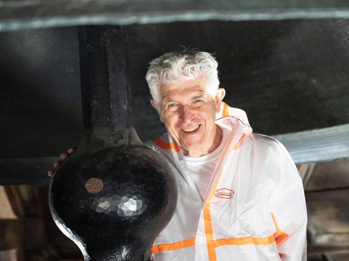 Artist Bill Fontana with the clapper for the largest and oldest of Notre Dame’s ten bells, Emmanuel Courtesy of the artist