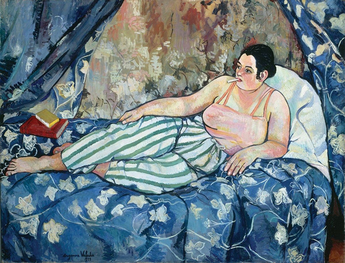 In The Blue Room (1923), Valadon replaces the traditional female nude with a woman wearing stripey trousers, a cigarette hanging from her mouth Photo: Jacqueline Hyde; © Collection Centre Pompidou; © 2021 ARS, New York/Image © CNAC/MNAM; Dist. RMN-Grand Palais/Art Resource, NY