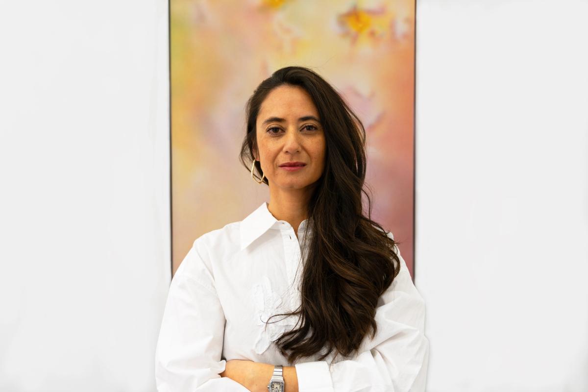 Sarah Le Quang Sang, in front of a work by Damaris Athene

Courtesy SLQS Gallery. Image by Eliot Gelberg-Wilson