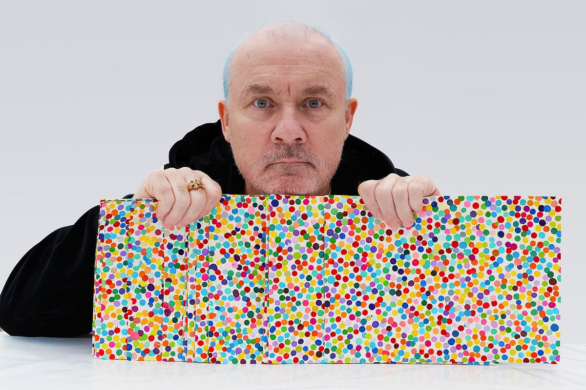 Damien Hirst with The Currency artworks in 2021 Photo: Prudence Cuming Associates Ltd. Courtesy of Damien Hirst and Science Ltd. All rights reserved, DACS 2022
