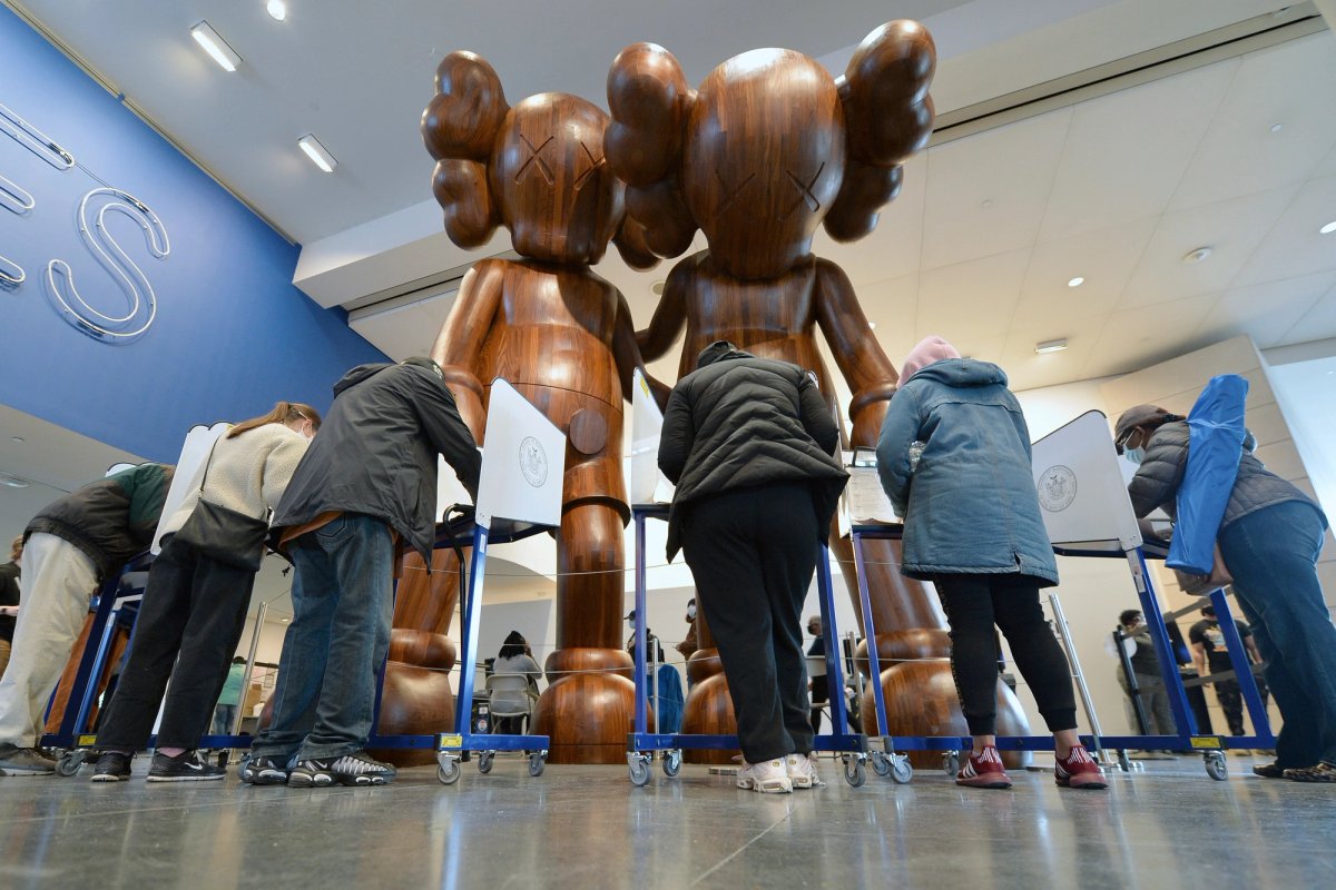 Voters fill out their ballots at privacy booths inside the Brooklyn Museum on day five of early voting for the 2020 Presidential Elections in the Brooklyn borough of New York City, 28 October 2020. It is estimated that 66 million people have already cast their ballots before election day on 3 November, breaking early voting records in US election history. (Anthony Behar/Sipa USA via AP Images)