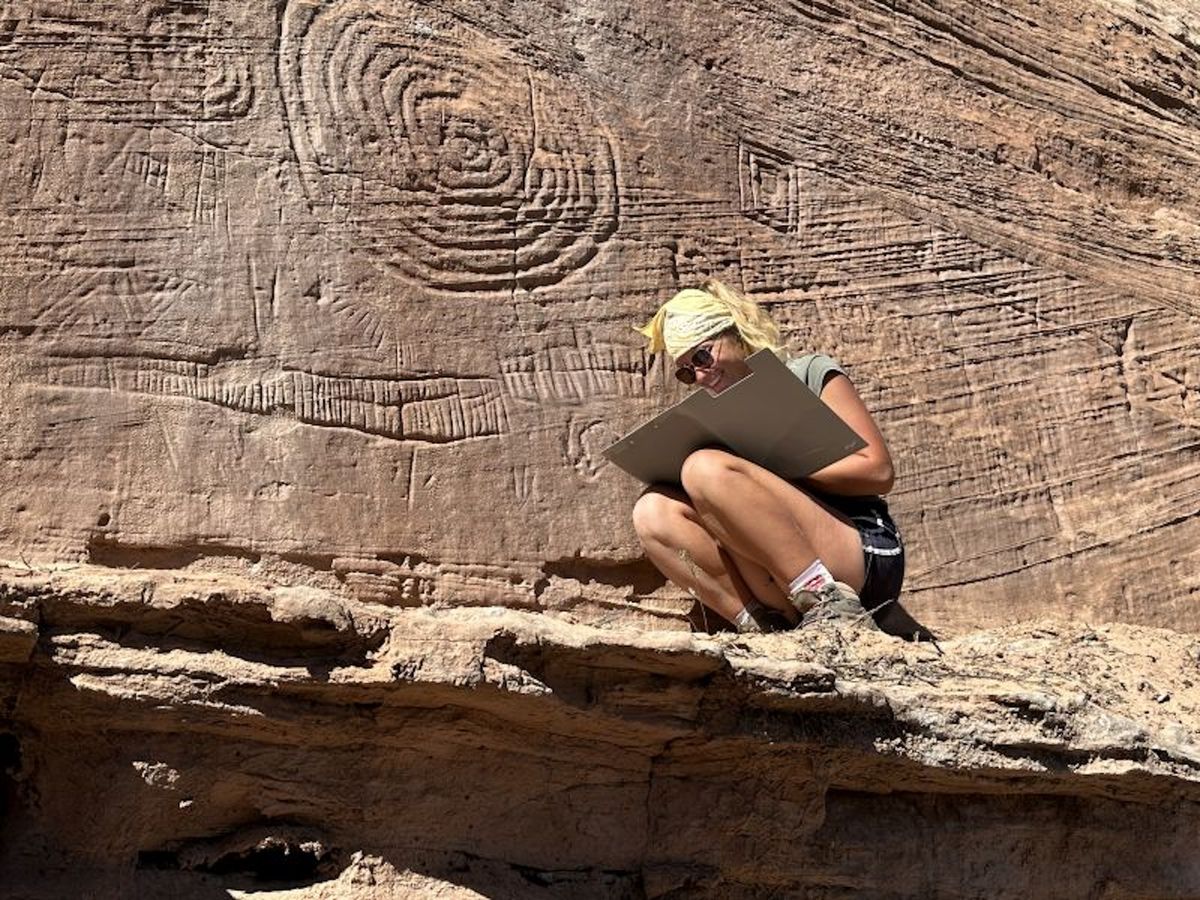 A researcher next to one of the ancient petroglyphs under analysis in Colorado's Mesa Verde National Park Jagiellonian University