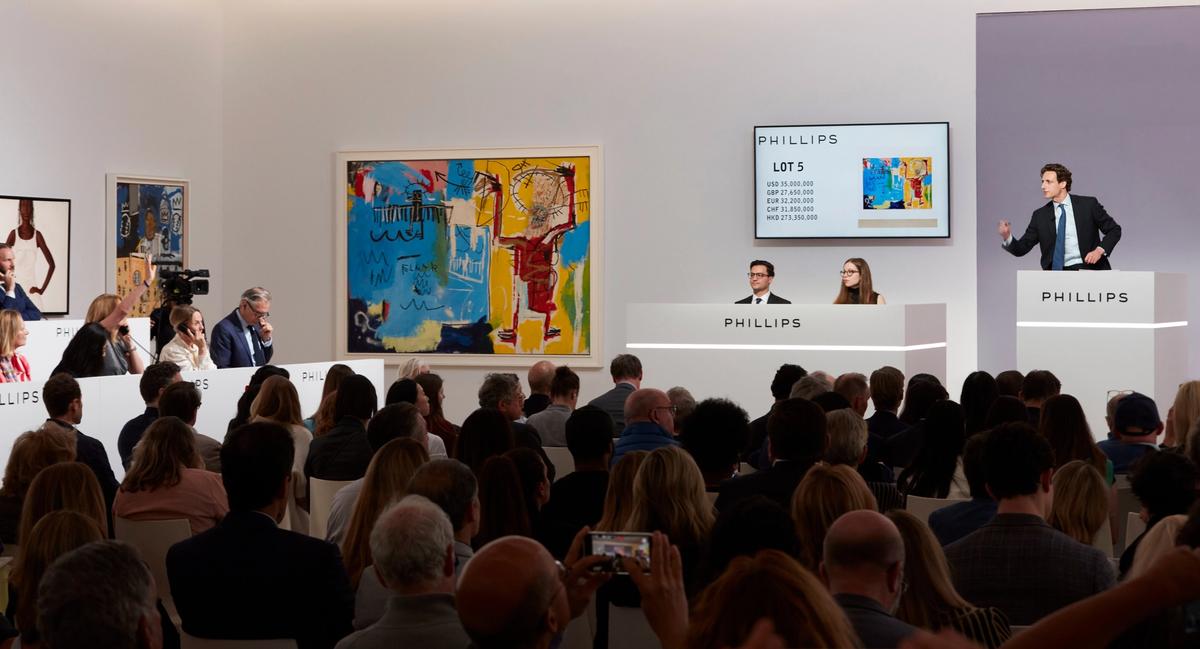 Phillips auctioneer Henry Highley sells Jean-Michel Basquiat's 1982 canvas Untitled (ELMAR) during the auction house's Modern and contemporary art evening sale in New York Courtesy Phillips
