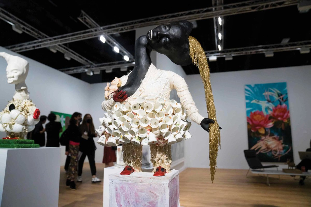 vanessa german, Footnote: (2021), Kasmin, New York Photo by Eric Thayer
The Philadelphia-based artist vanessa german is a storyteller. Every piece of this assemblage sculpture feels like it had a history of its own before it was gathered to form this intricately detailed bust. Found fabrics, vintage hand-blown glass beads, ceramics and Danbury porcelain bells come together to form this work, which, according to the wall text, also includes more poetic materials like “old love”, “new love” and “a lost mind come to find its own self”. german sees art as a way to promote social healing for Black communities in the US, and in her work tries to prioritise creativity and tenderness as a way to reckon with the tragedy of structural racism. This sculpture, priced at $40,000, is one of three on view