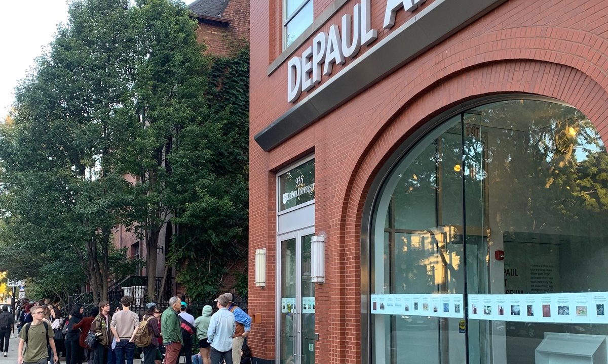 Image accompanying source report: More than 100 people queued in silence outside Chicago's closed DePaul Art Museum to protest its shutdown