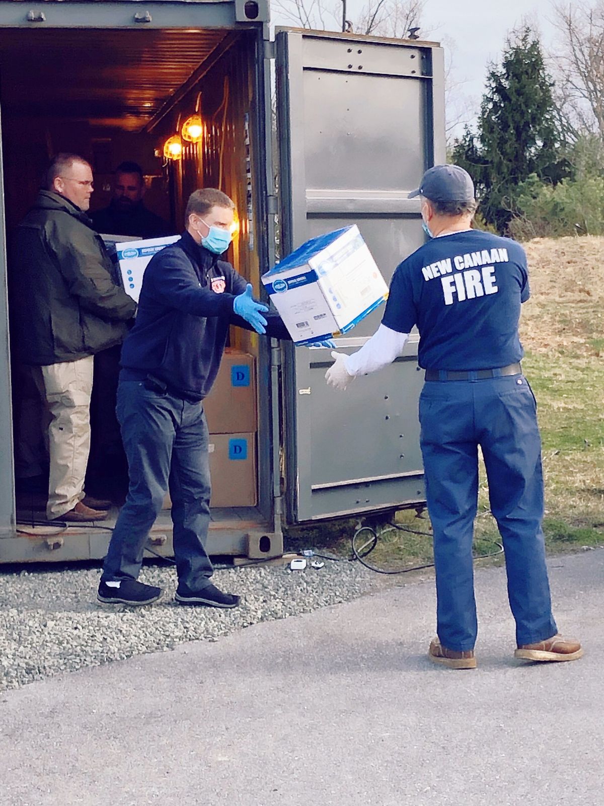 The New Canaan Fire Department picks up PPEs at Grace Farms in Connecticut for distribution to healthcare workers and first responders in the area. Courtesy of Grace Farms