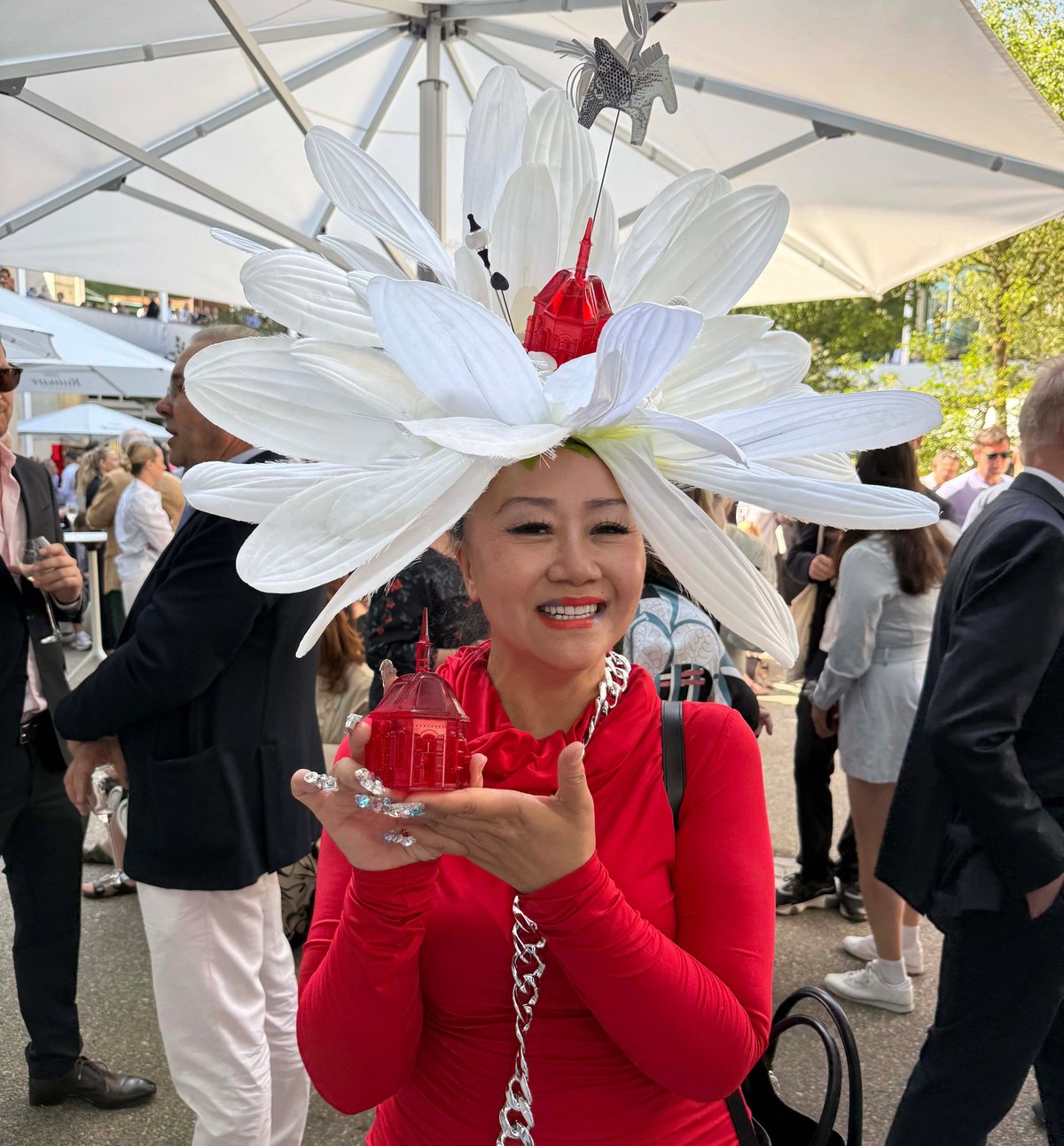 Height restrictions apply: JingParis Artist’s floral headgear is competing with art on the stands