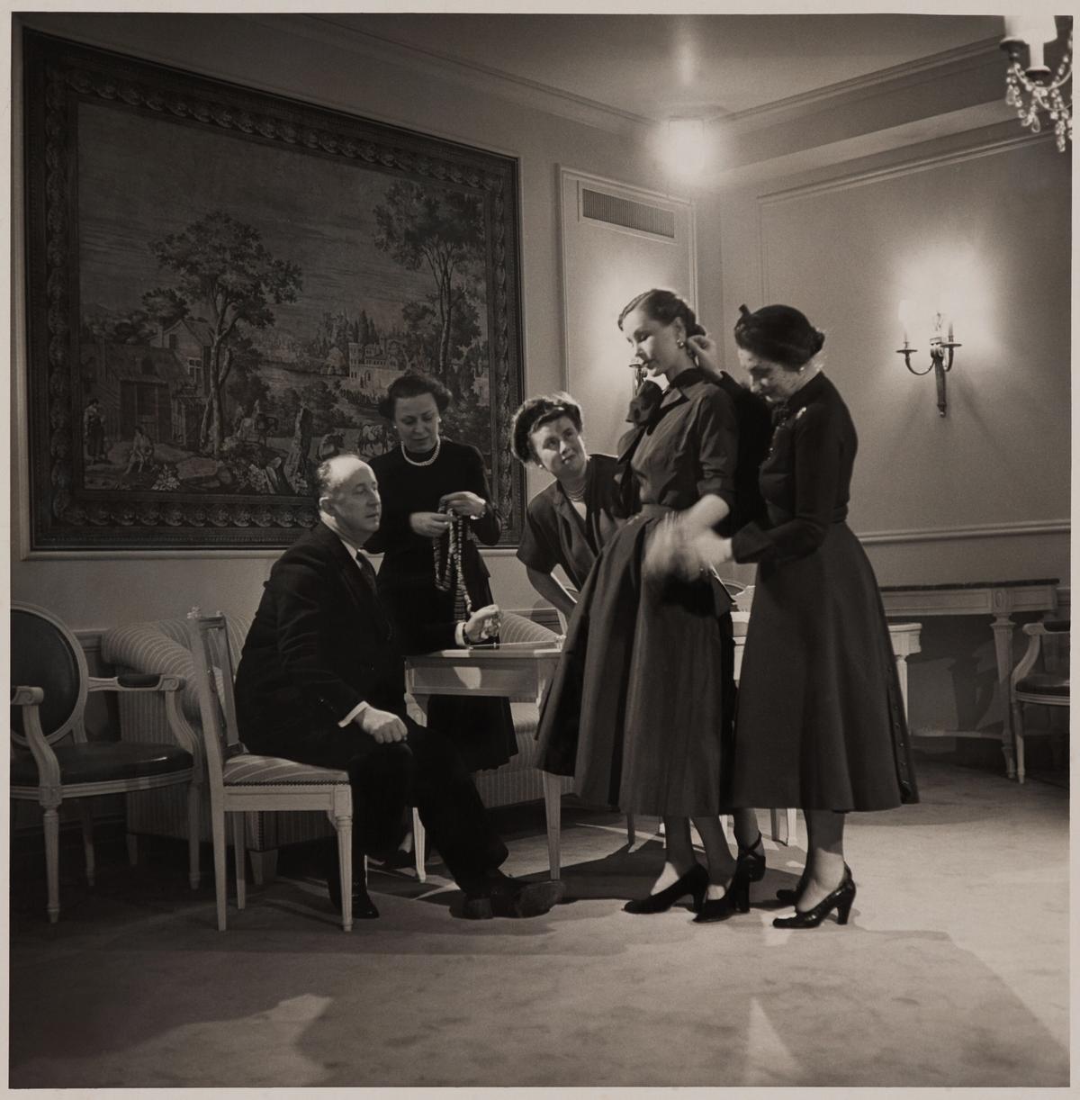 Fitting in a Christian Dior–New York salon with (left to right) Christian Dior, Raymonde Zehnacker, Marguerite Carré, Mrs. Knoll, and Mizza Bricard, 1948 Brooklyn Museum Libraries and Archives. BMA artist files