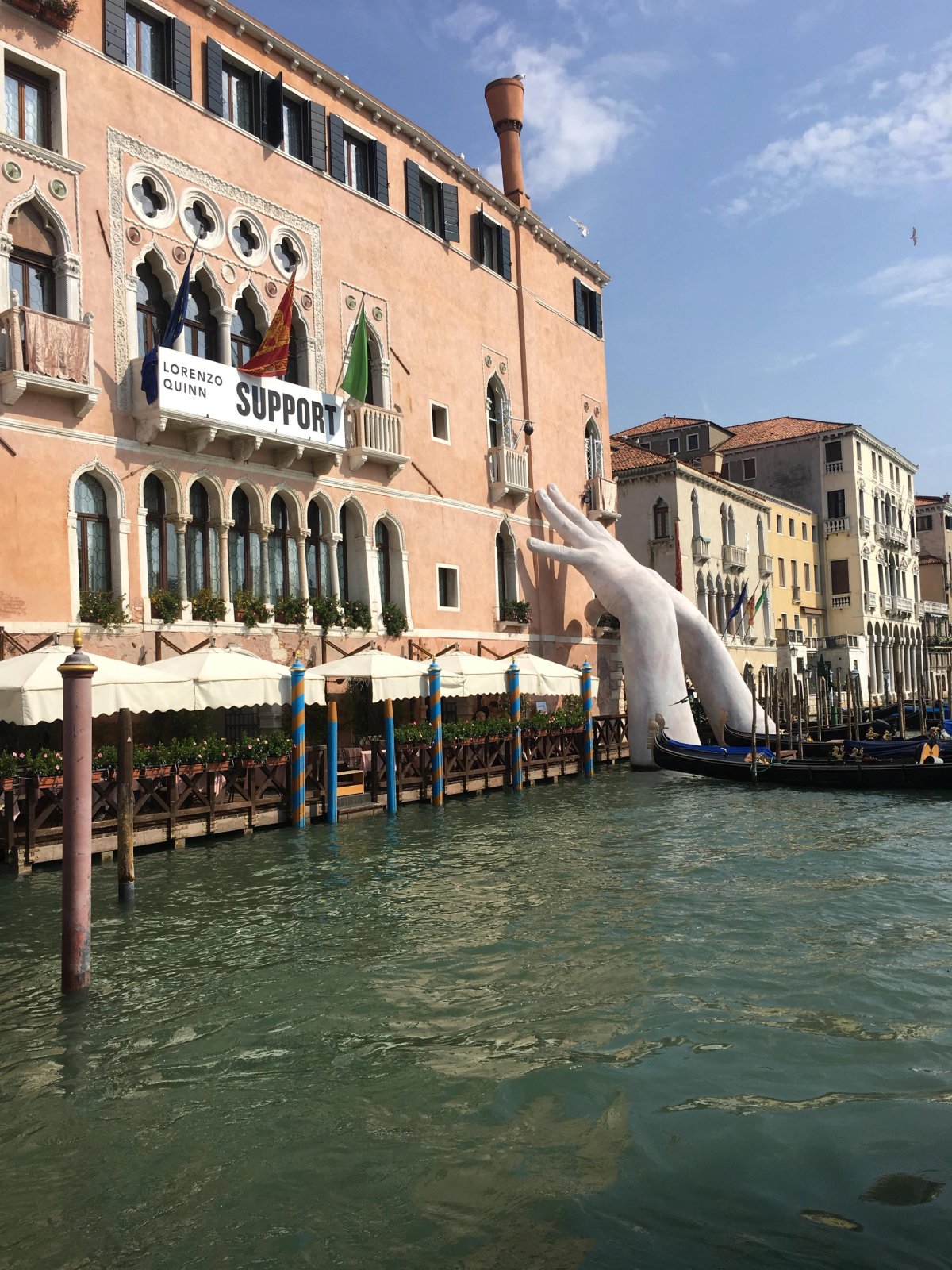 Lorenzo Quinn's installation Support (2017) at Ca' Sagredo palace in Venice during the 57th Venice Biennale Aimee Dawson